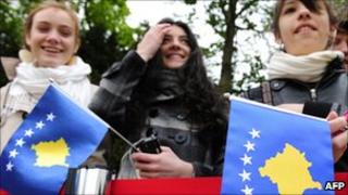 Girls holding Kosovo flags - file pic