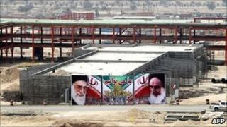 A banner - with portraits of Iran's supreme leader Ayatollah Ali Khamenei and his predecessor Ayatollah Ruhollah Khomeini - on a building being built in the South Pars gas field development in Asaluyeh