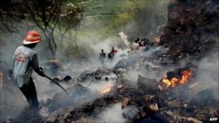 Pakistani rescue workers search for survivors at The Margalla Hills on the outskirts of Islamabad