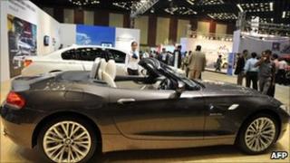 Indian delegates and staff look at BMW Z4s Drive35i on display at The Hyderabad International Auto Show 2010 at The Hyderabad International Convention Centre (HICC) in Hyderabad on July 22, 2010
