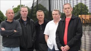 Terry Cowell (l) and other workers outside Halfords