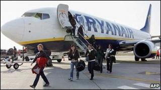 Passengers disembarking from a Ryanair aircraft