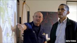Barack Obama (R) and Thad Allen