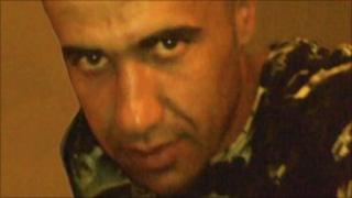 Photo of a man wanted by police in connection with the rape