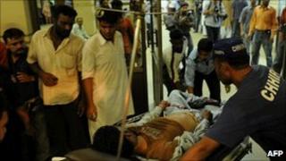 An injured man at a hospital in Karachi on August 4, 2010