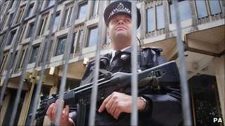 An armed police officer outside the US embassy in London