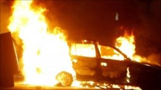 Car on fire during rioting in the Ardoyne