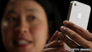 iPhone 4 being demonstrated, Getty