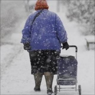 Elderly lady out in the snow
