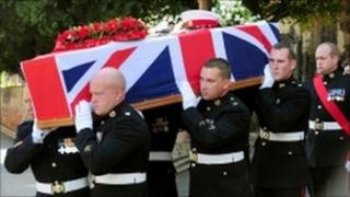 The coffin being carried from St John's Church