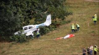 Picture of plane in bushes after crash