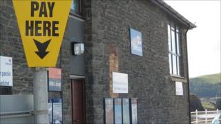 A pay and display sign near Aberystwyth lifeboat station