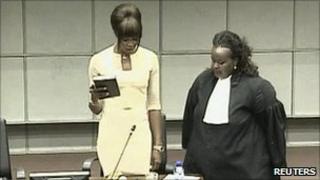 Naomi Campbell (left) is sworn in at The Hague, 5 August (video grab)