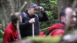 searchers in Argyll Forest