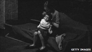 Mother and child take shelter from bombing in London in 1940