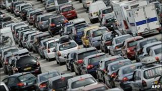Cars queue at a toll on the A7 motorway in Vienne, eastern France