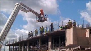 The Northfield Construction worker was rescued from the new Worcester library and history centre site after his back went into spasms