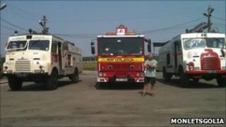 Red fire engine and two Green Goddesses