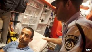Nadim Injaz in an ambulance after having been handed over to the Israeli authorities, 17 August 2010