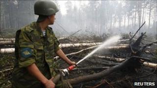 Russian soldier fights fires in village of Kartanosovo in Ryazan region