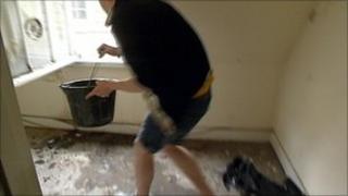 Bath resident removes rainwater from his property