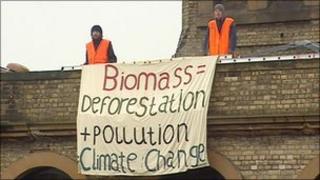 Protesters on a roof top in Leith