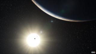 Впечатление художника о планетной системе, вращающейся вокруг HD 10180 (Фото: ESO)