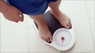 Man on weighing scales