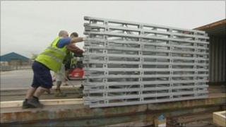 Workers loading bridges