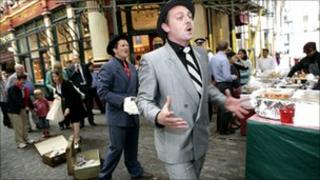 Street performers Jim and Bert entertain the crowds in London
