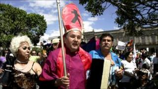 Gay rights campaigners protest outside Guadalajara cathedral