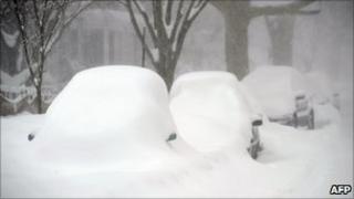 Cars blanketed under thick snow in Washington DC