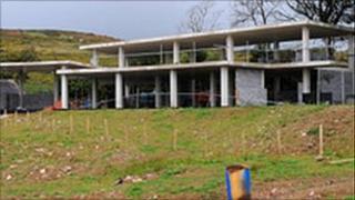 The part-built mansion