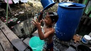 Child washes in a slum in Manokwari