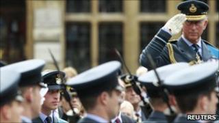 Prince Charles salutes after a thanksgiving service for the 70th anniversary of the Battle of Britain
