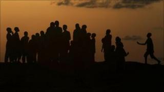 Children play on Dala hill at sunset in the old city district in Nigeria's northern state of Kano