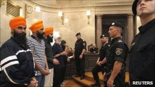 File picture of the six accused in court in Vienna (10 September 2010)