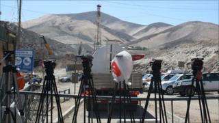 Media checking their view at the mine
