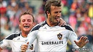 David Beckham(r) celebrates scoring for LA Galaxy against Chivas USA