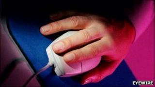 Hand on computer mouse
