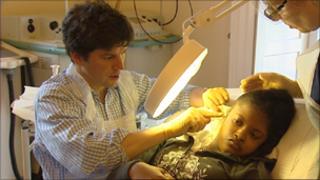 Surgeons work on Kade Romain