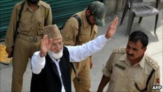 Indian police arrest Syed Ali Shah Geelani (arms raised) in Srinagar on 8 September 2010