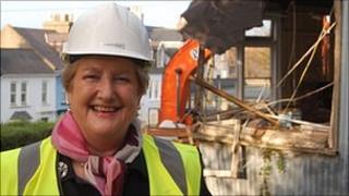 Jenny Tasker in front of St Stephen's Community Centre being demolished