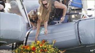 Tiffany Hartley (c) lays a wreath near the site where her husband was shot last month on Falcon Lake in Zapata, Texas (file image from Oct 6 2010)