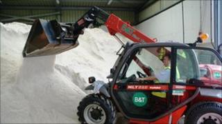 Digger moving grit