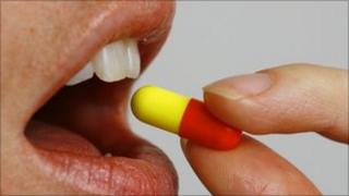 Person taking a tablet (generic)