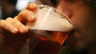 Man drinking a pint of beer