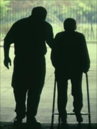 Elderly man with zimmer frame