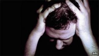 Man with his head in his hands