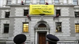 Protesters unveil banner